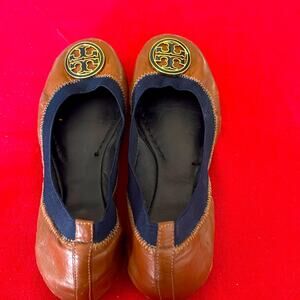 Tory Burch Brown and Black Flats with Metallic Medallion